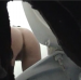 A woman is observed pooping into a toilet in a public restroom through a hole in the wall in this voyeuristic-styled video clip.